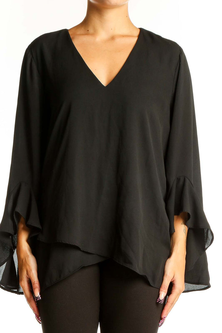 Front view of black Vince Camuto V-neck blouse with bell sleeves