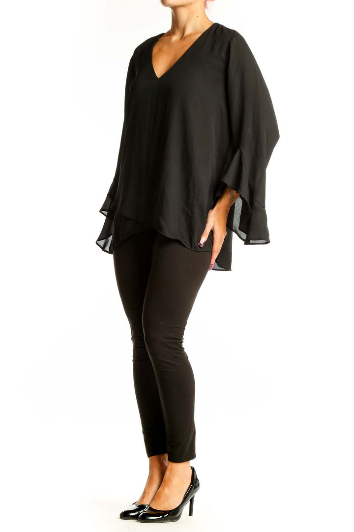 Front view of black Vince Camuto V-neck blouse with bell sleeves