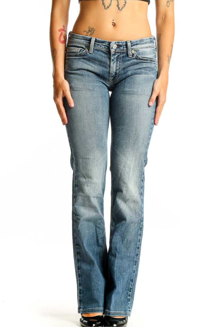 Front view of 7 For All Mankind light blue bootcut jeans on model