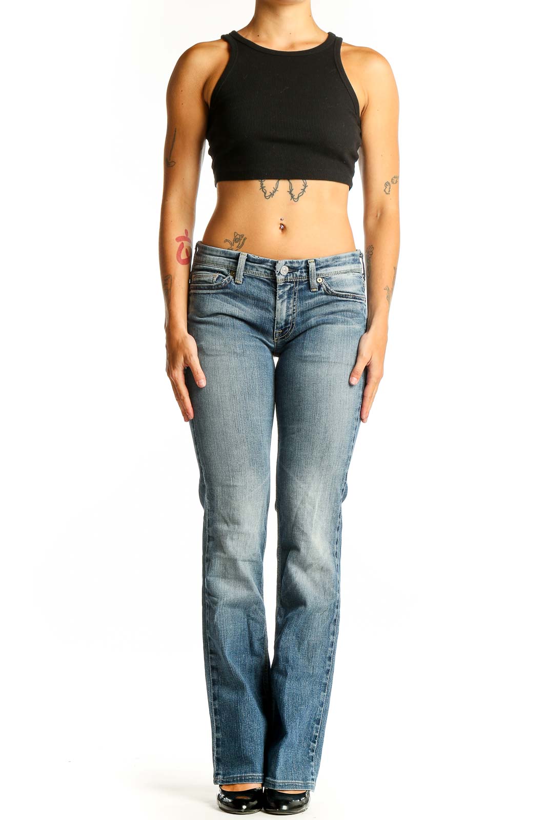 Front view of 7 For All Mankind light blue bootcut jeans on model