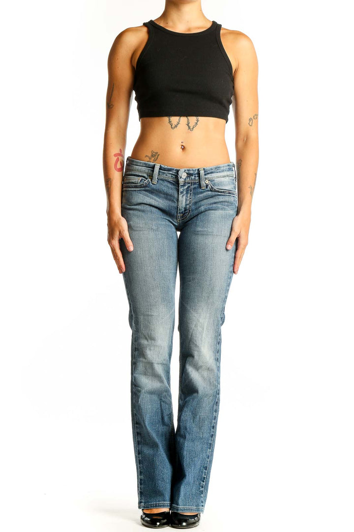 Front view of 7 For All Mankind light blue bootcut jeans on model