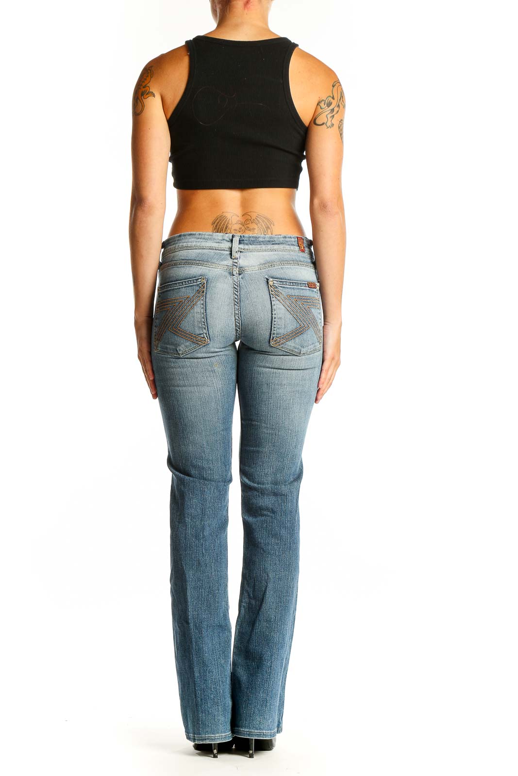 Back view of 7 For All Mankind light blue bootcut jeans on model