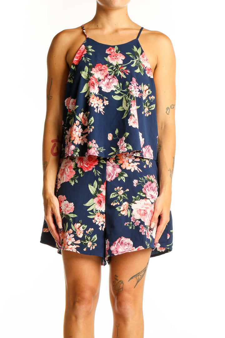 Front view of Lulu's navy floral sleeveless romper with overlay top