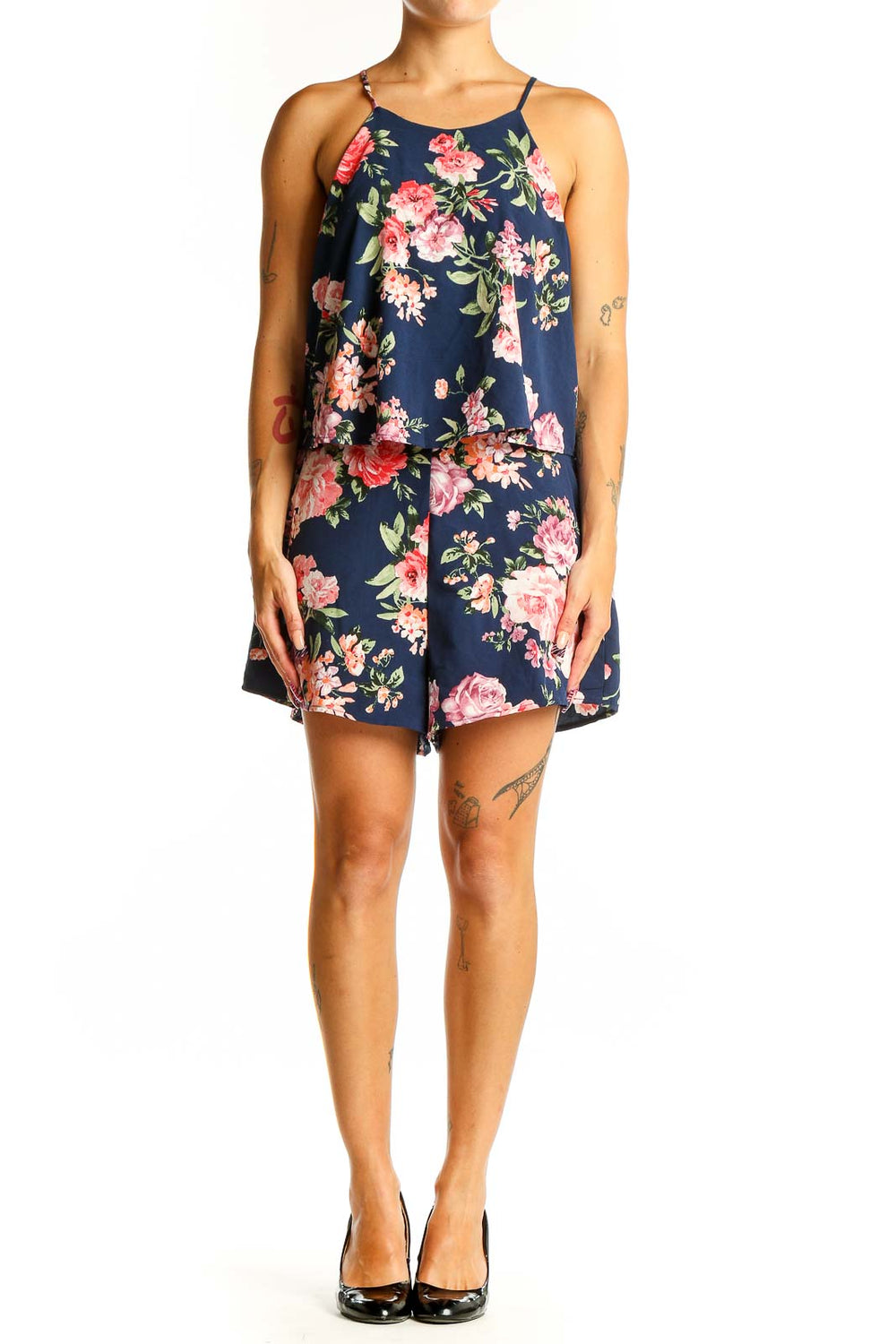 Front view of Lulu's navy floral sleeveless romper with overlay top