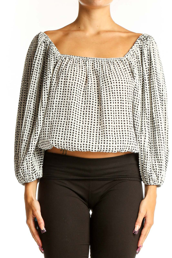 Front view of Lucy Paris White Polka Dot Crop Top with balloon sleeves