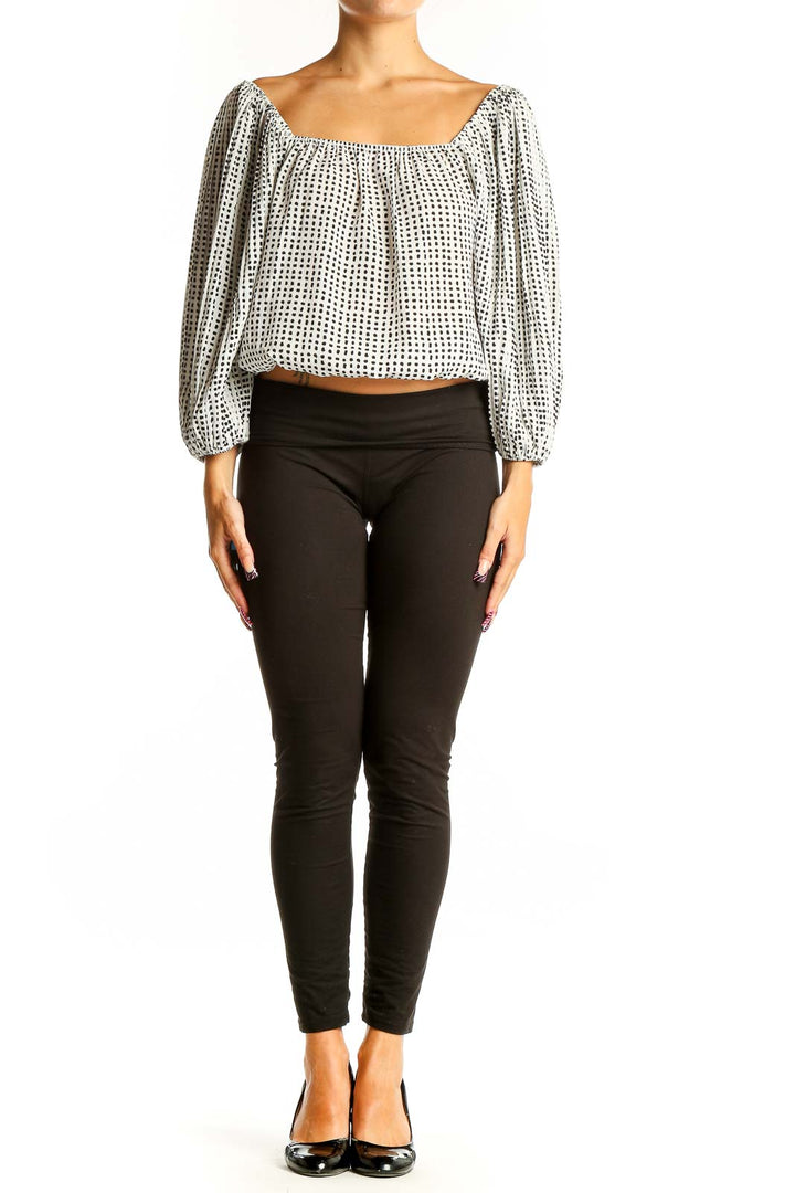 Front view of Lucy Paris White Polka Dot Crop Top with balloon sleeves