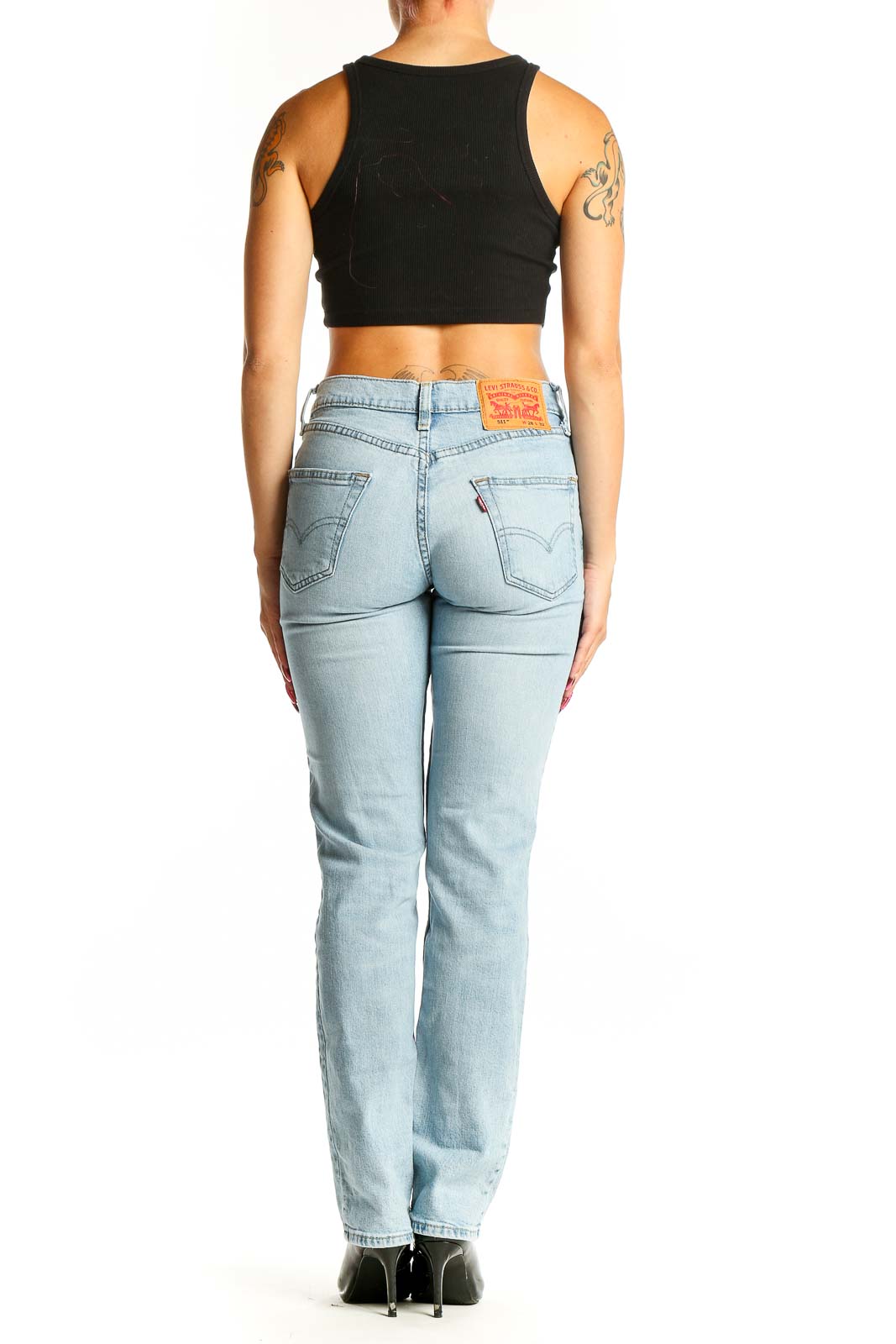 Back view of Levi's light blue straight leg jeans on model