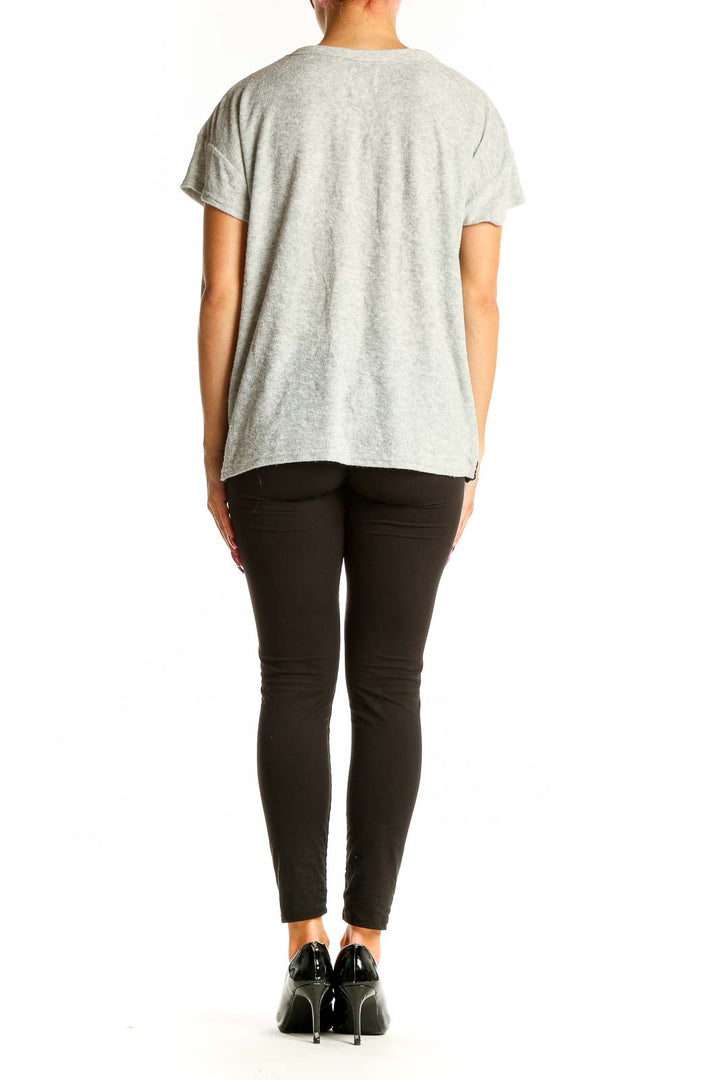 Side view of gray JUICY by Juicy Couture t-shirt showing side stripe detail