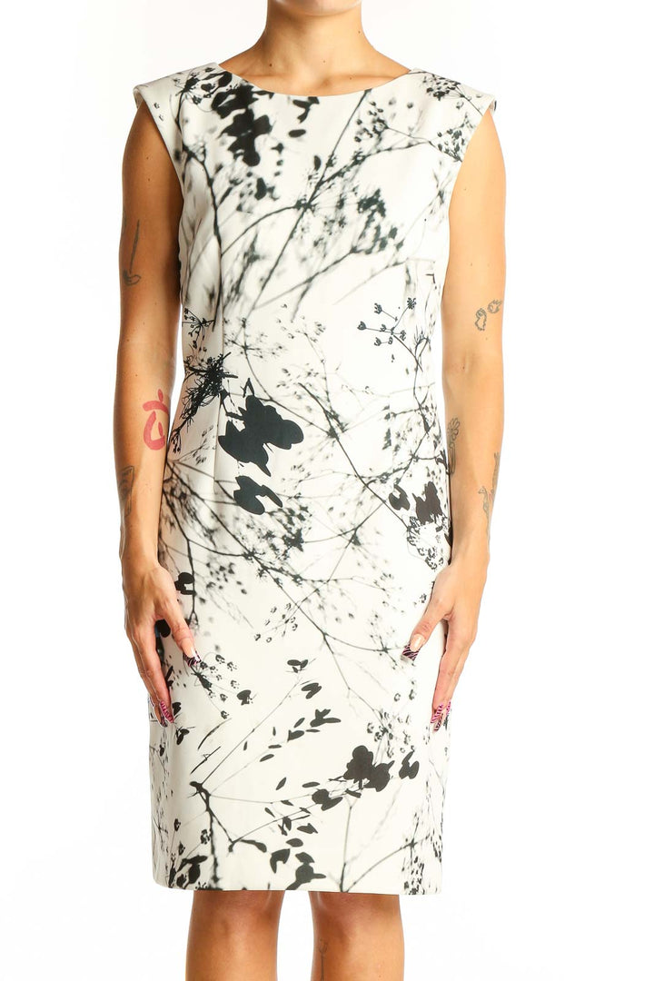 Front view of Tahari Arthur S. Levine white sheath dress with black abstract floral print
