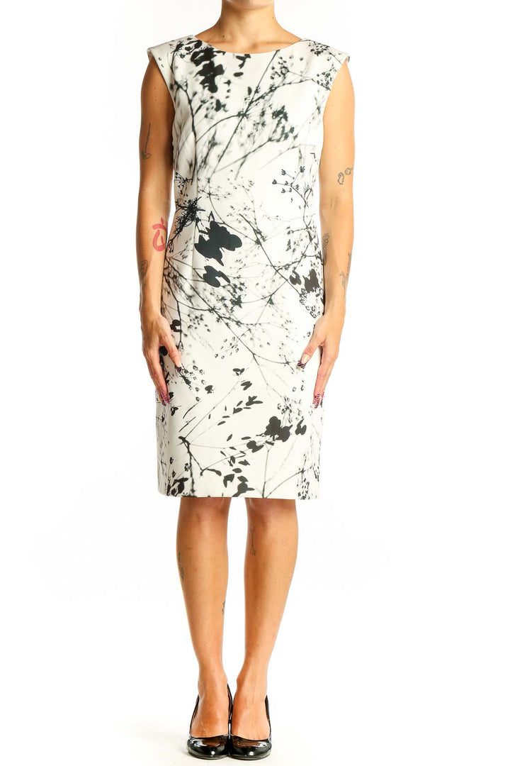 Front view of Tahari Arthur S. Levine white sheath dress with black abstract floral print