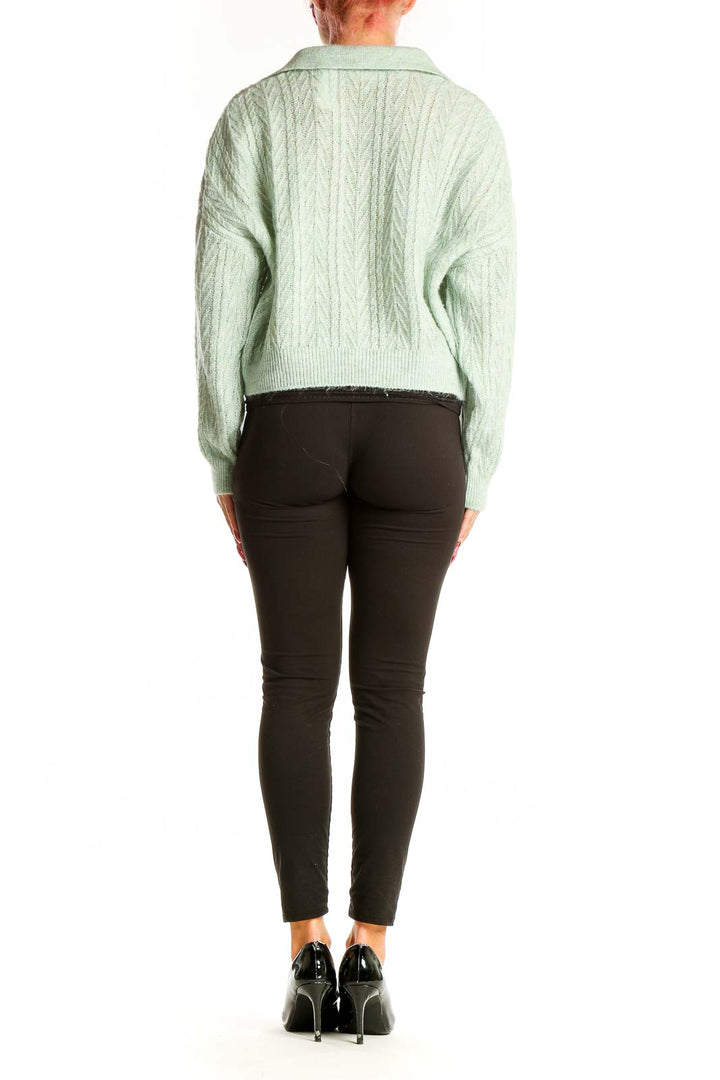 Side view of Mango mint green cable knit cropped sweater showing length and fit