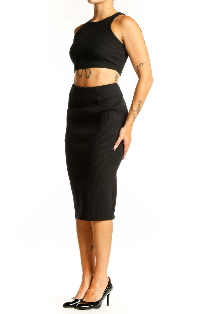 Front view of black fitted midi pencil skirt by Six Crisp Days