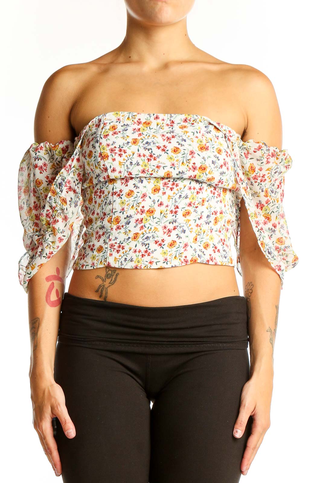 Front view of Flynn Skye floral off-shoulder crop top with puffy sleeves