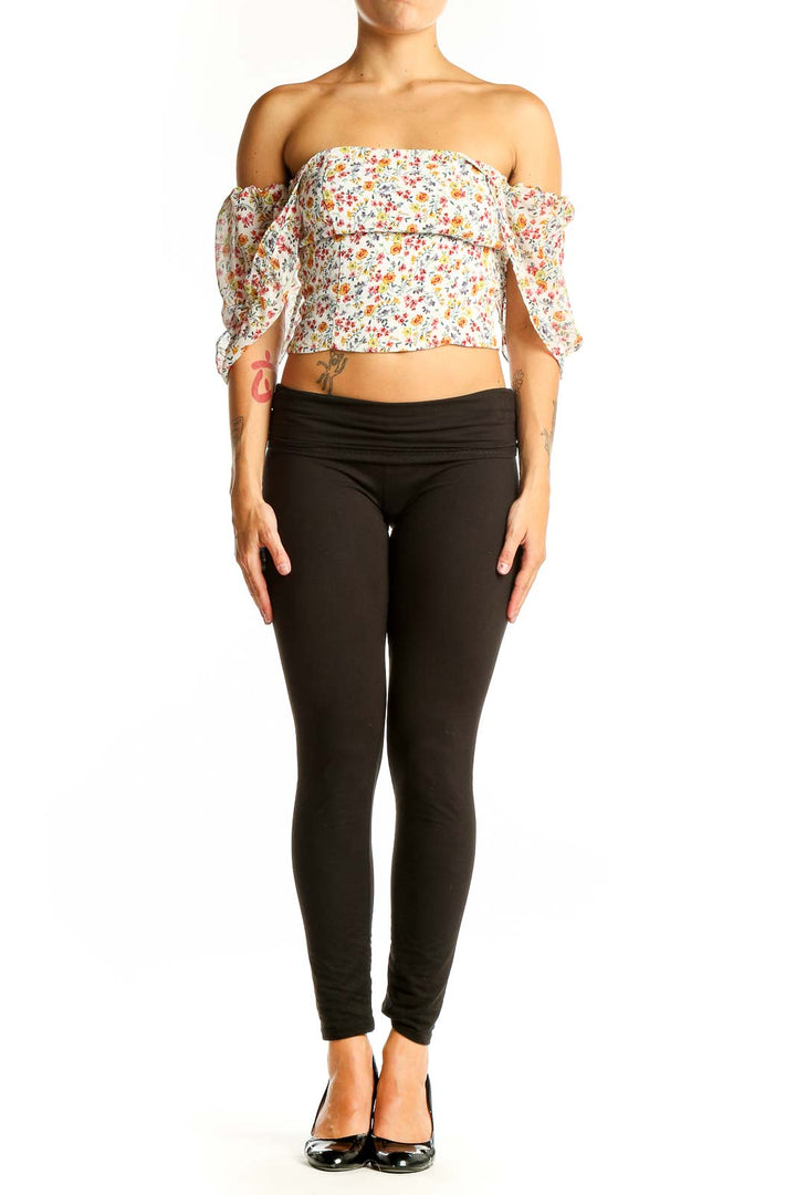 Front view of Flynn Skye floral off-shoulder crop top with puffy sleeves