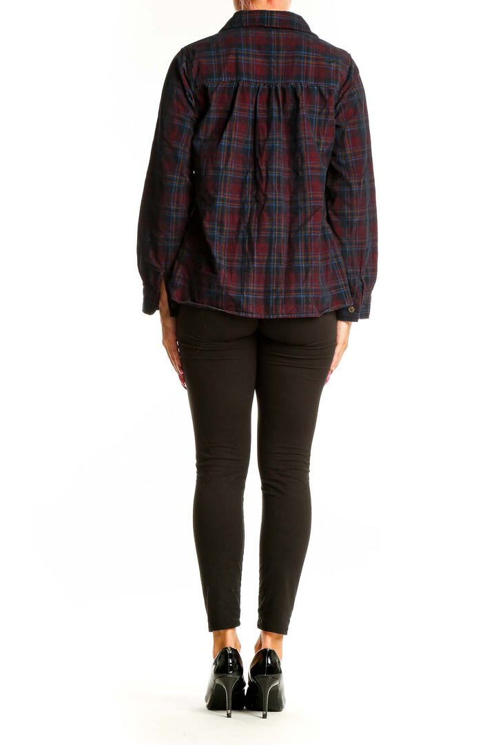 Side view of model wearing Christopher & Banks burgundy plaid cotton button-up shirt with black pants