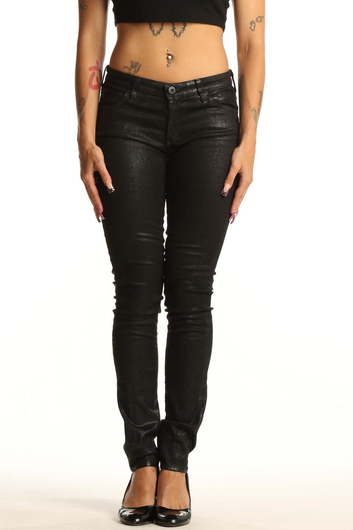 Front view of Adriano Goldschmied black coated skinny jeans on model
