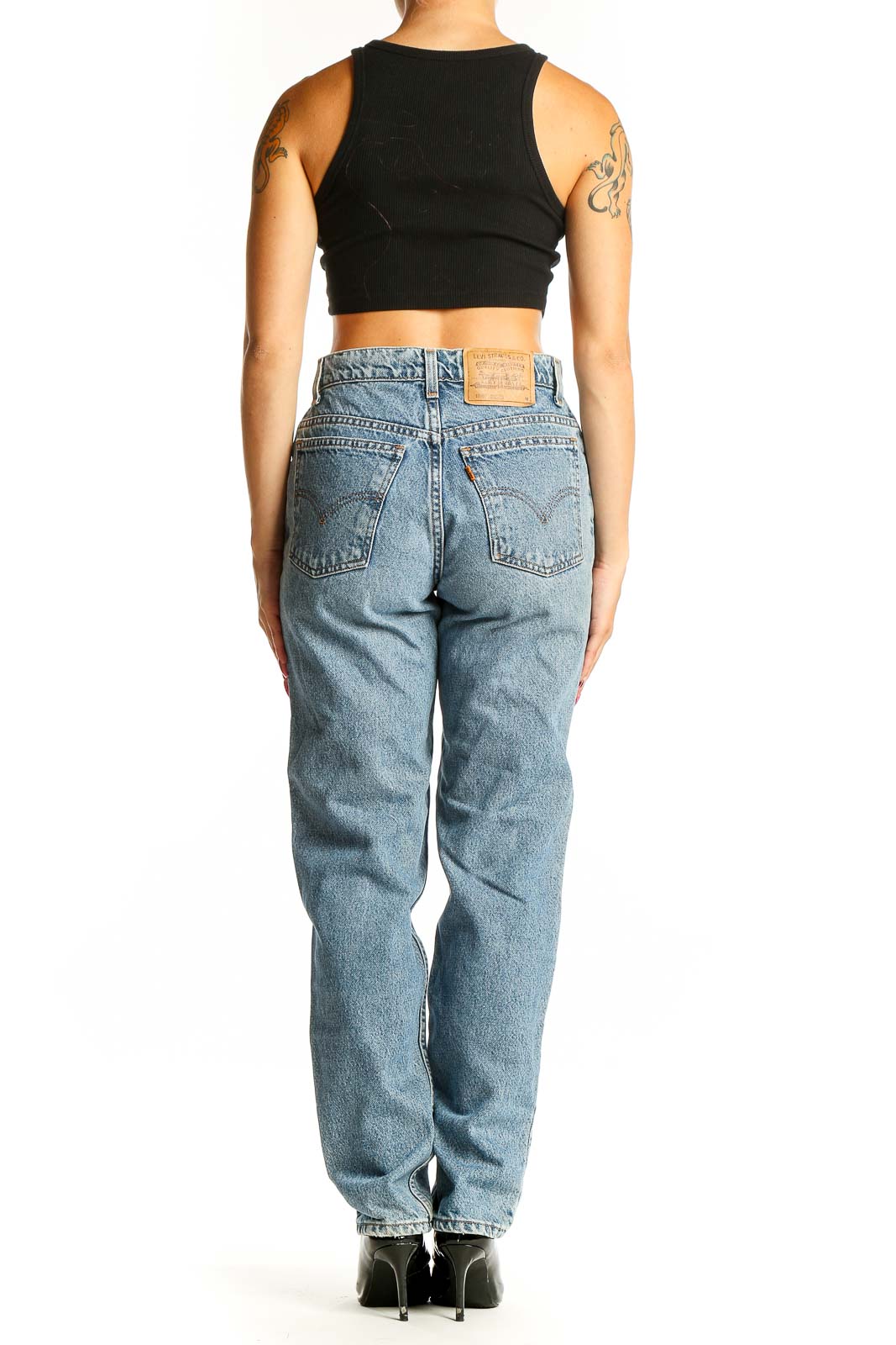 Side view of Levi's light blue straight leg jeans on model