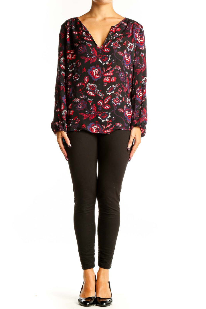 Front view of Joie black silk blouse with red and purple floral print