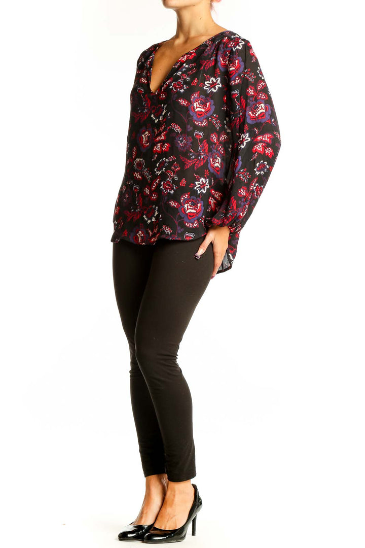 Front view of Joie black silk blouse with red and purple floral print