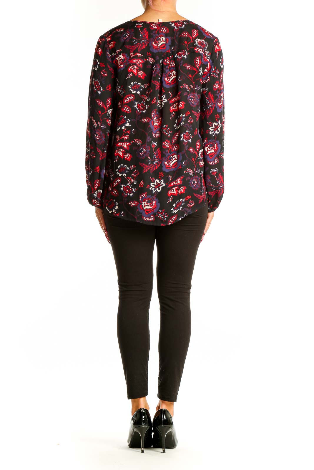 Back view of Joie black floral print silk blouse on model