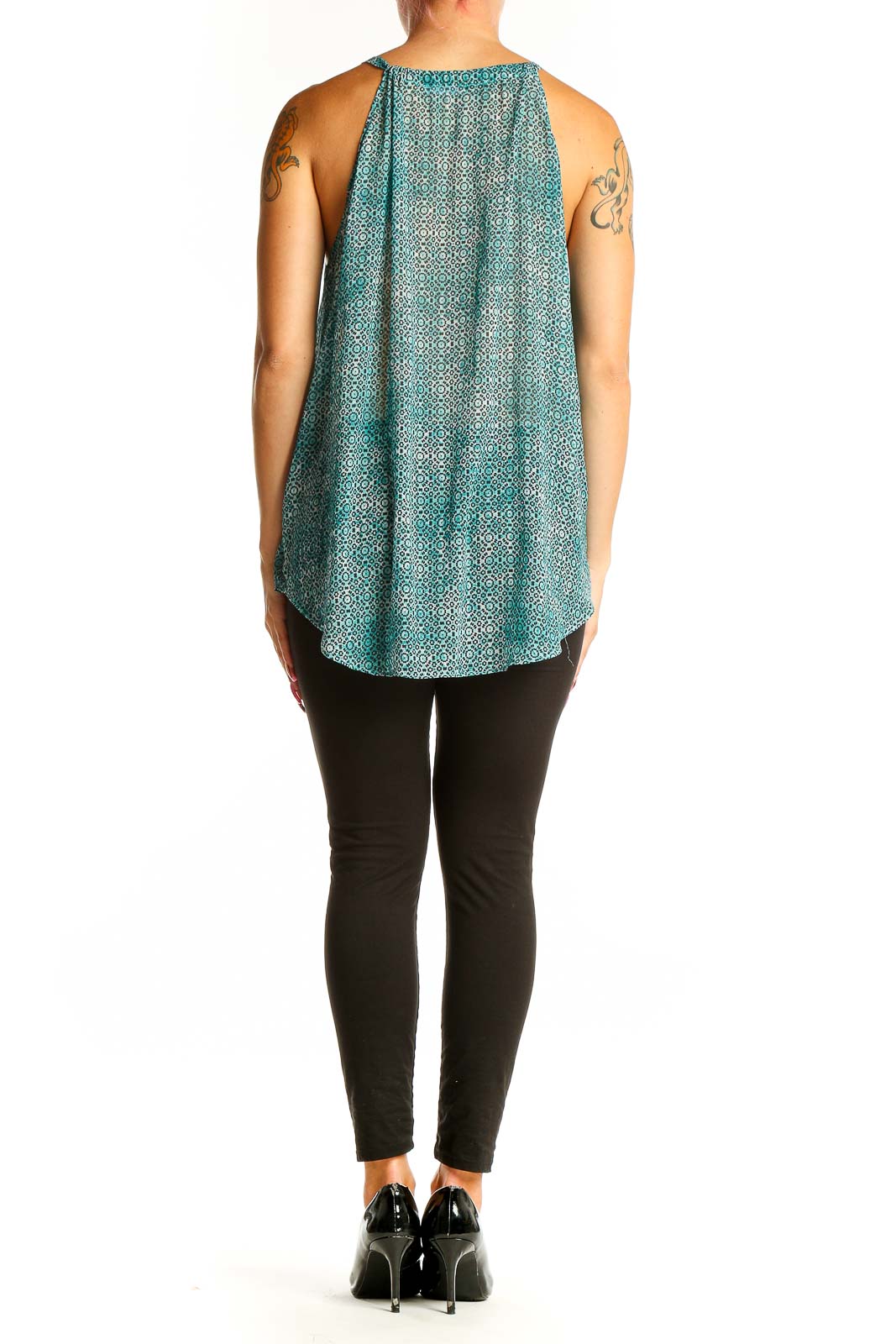 Side view of teal geometric print V-neck tank top by Tart on model