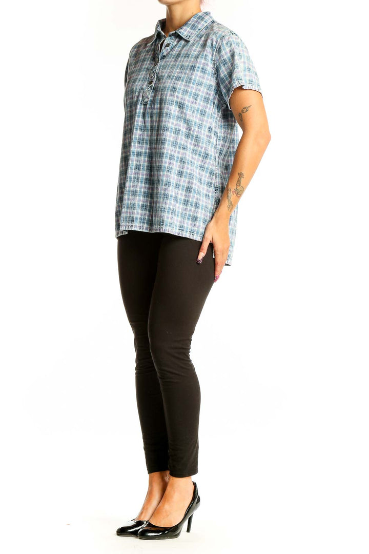 Front view of Orvis blue plaid cotton polo shirt on model