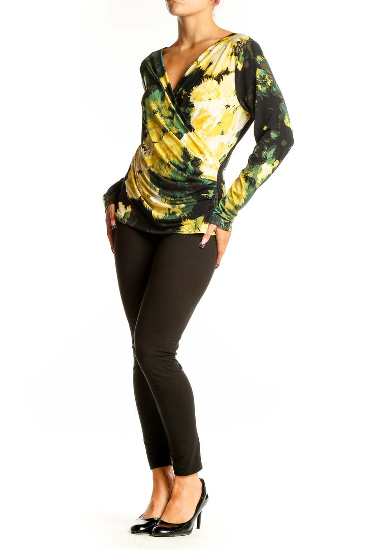 Front view of Calvin Klein yellow and green floral wrap top