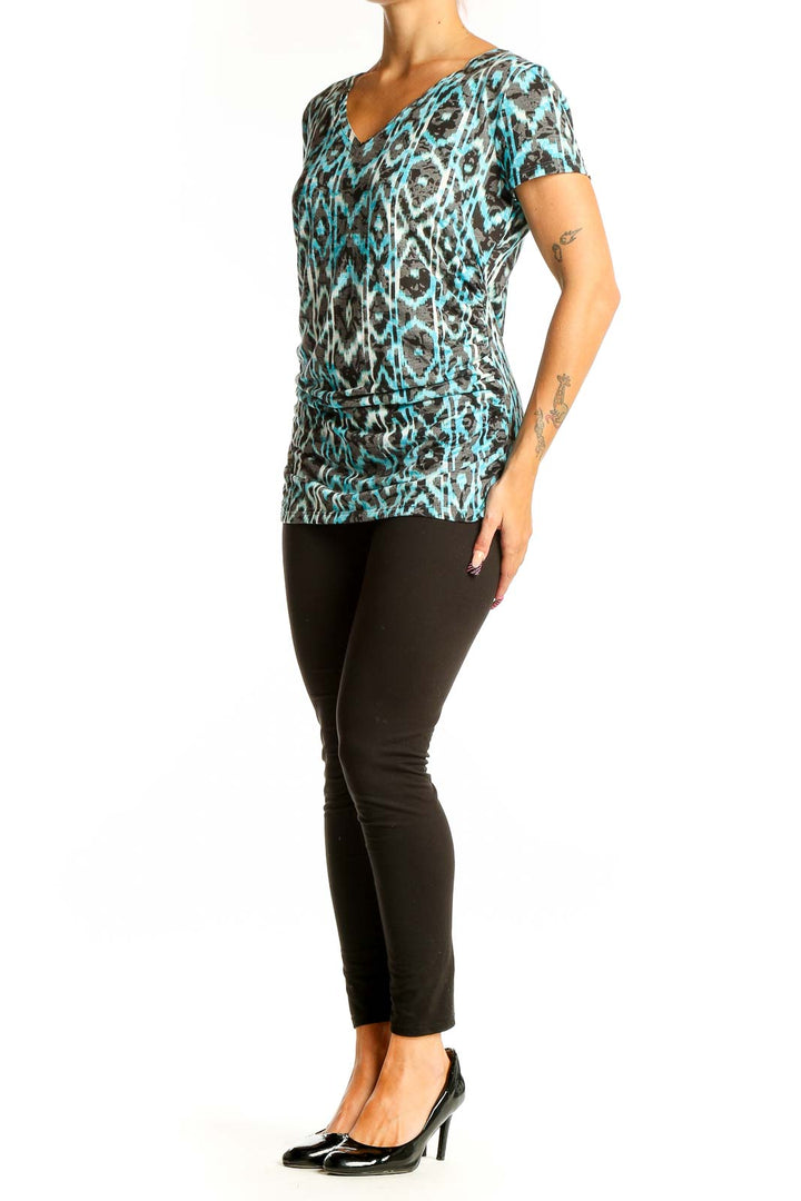 Front view of turquoise ikat print V-neck top by International Concepts