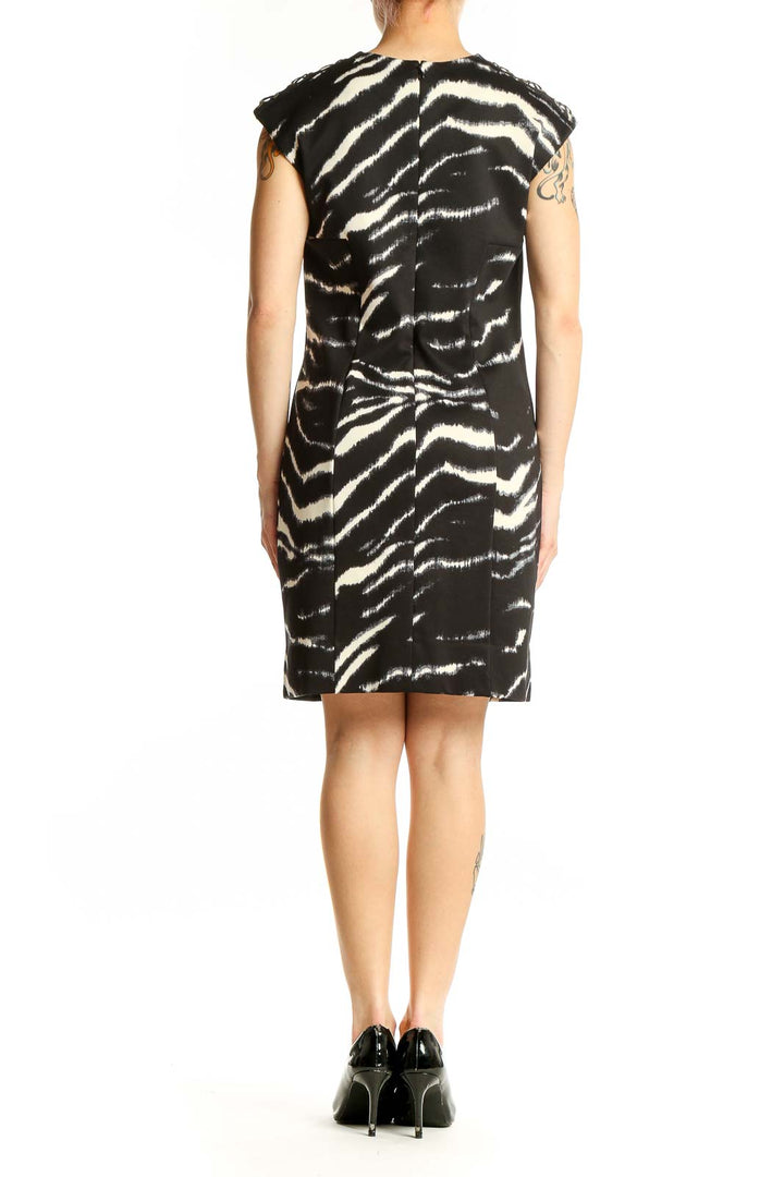 Side view of Michael Kors black and white zebra print sheath dress