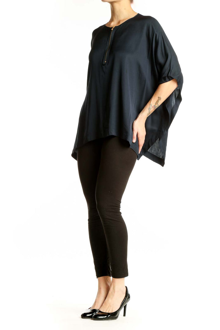 Front view of black oversized Vince blouse with zip-front detail