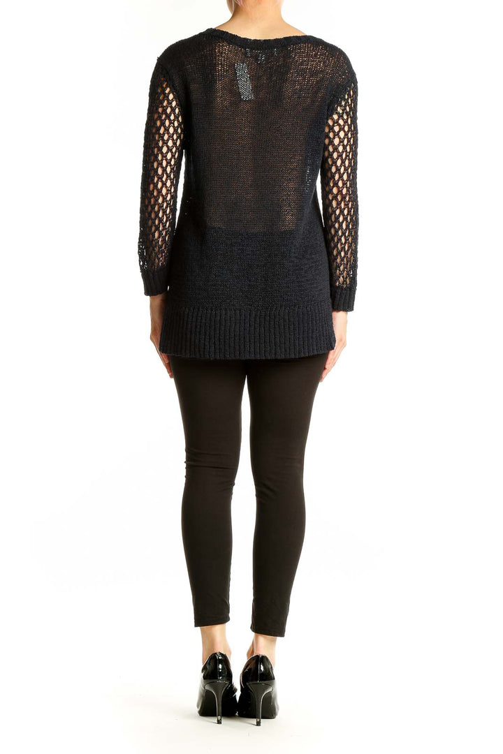 Side view of Ellen Tracy black open knit sweater showing texture and fit