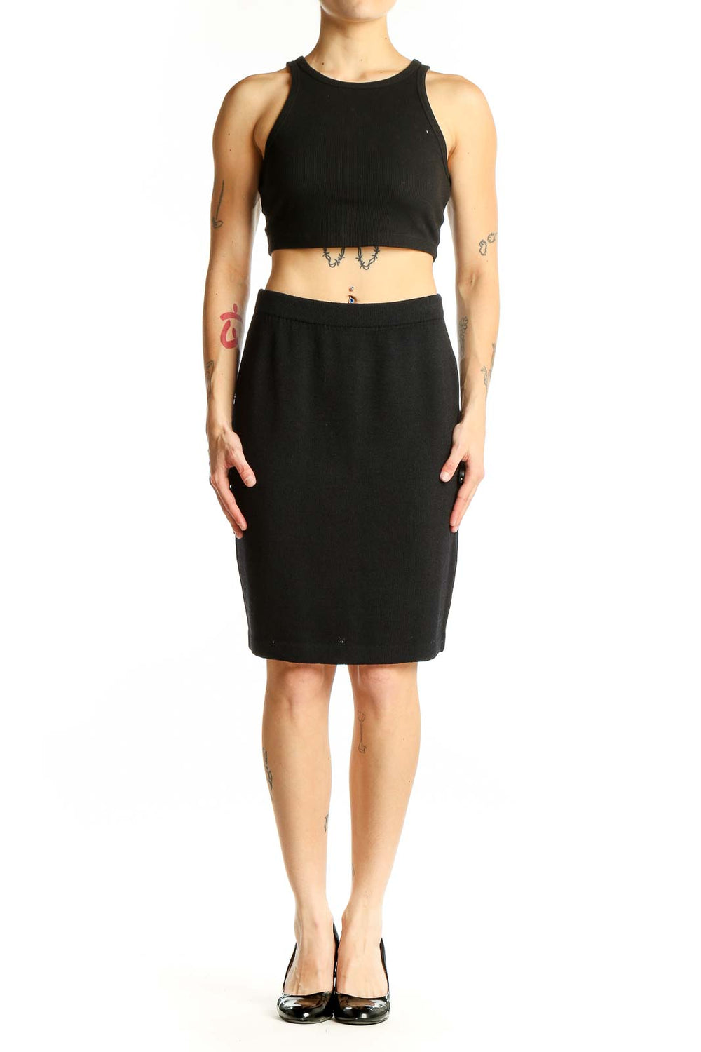 Front view of black St. John pencil skirt on model