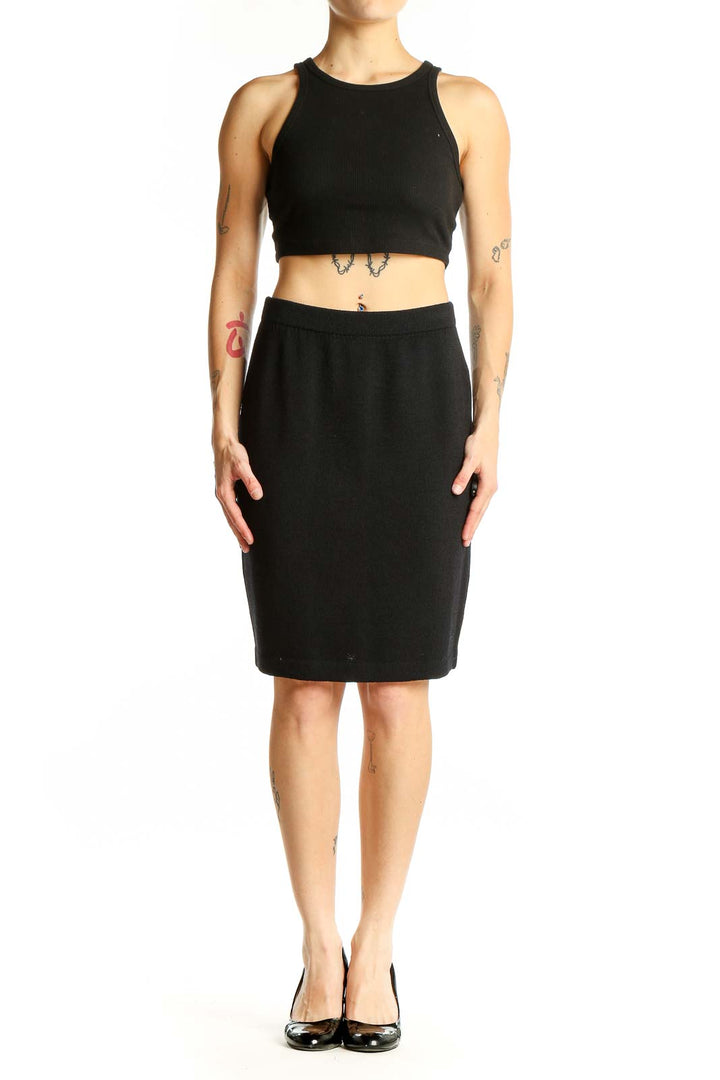 Front view of black St. John pencil skirt on model