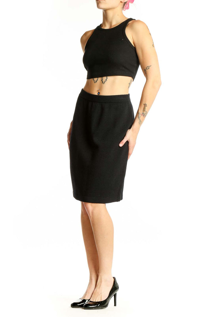 Front view of black St. John pencil skirt on model