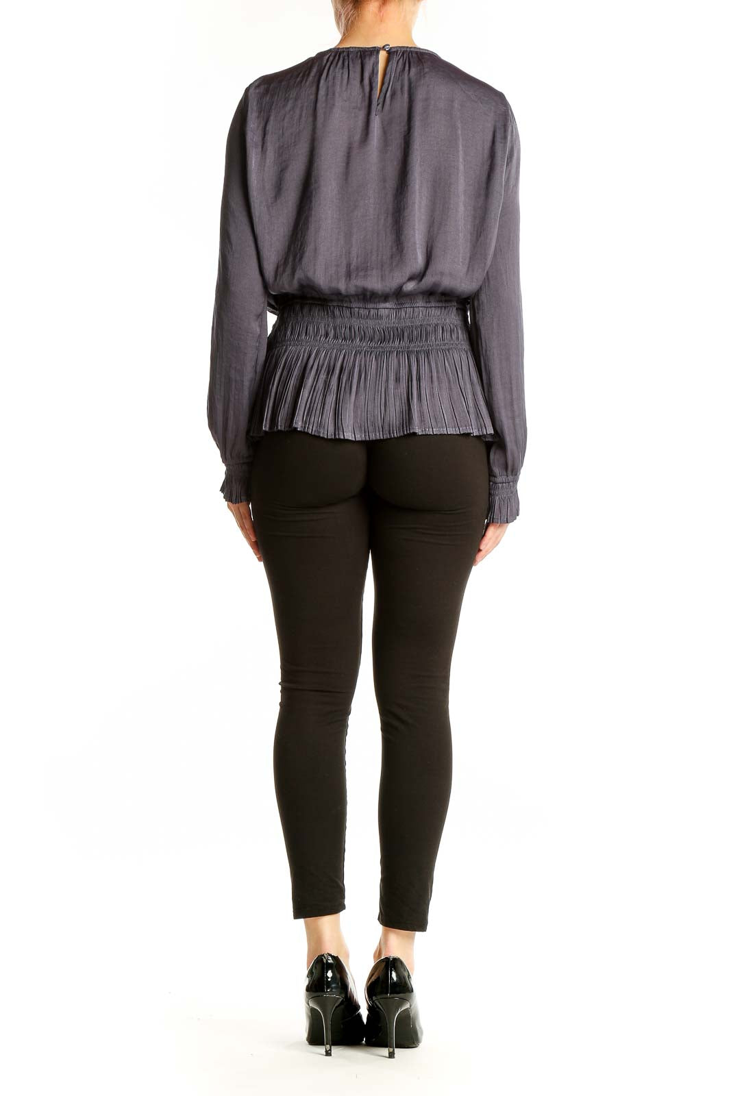 Side view of Tahari gray pleated peplum blouse showing peplum detail