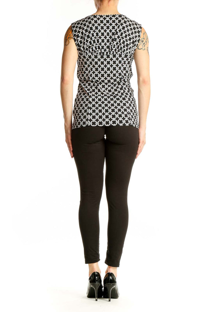 Side view of Black and White Geometric Print Sleeveless Top from White House Black Market
