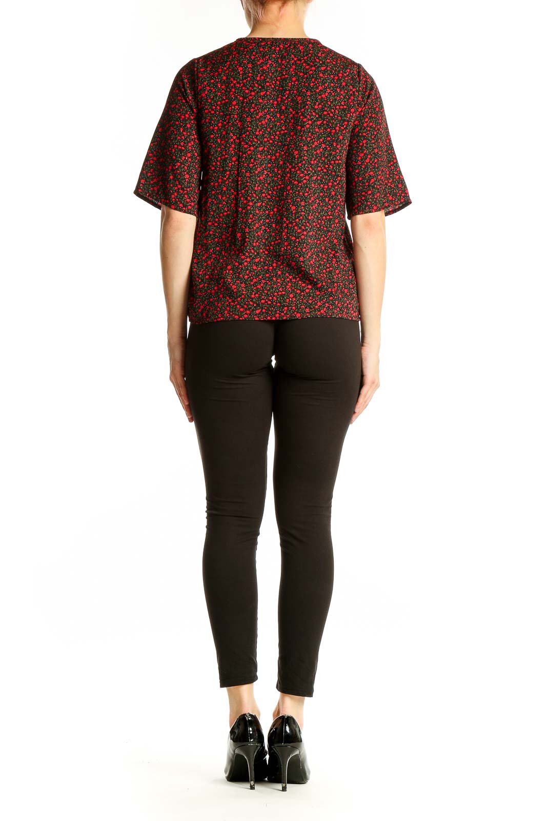 Side view of NastyGal red floral print blouse showing elbow-length sleeves