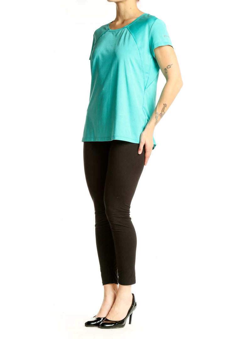 Front view of teal Columbia short-sleeve athletic top