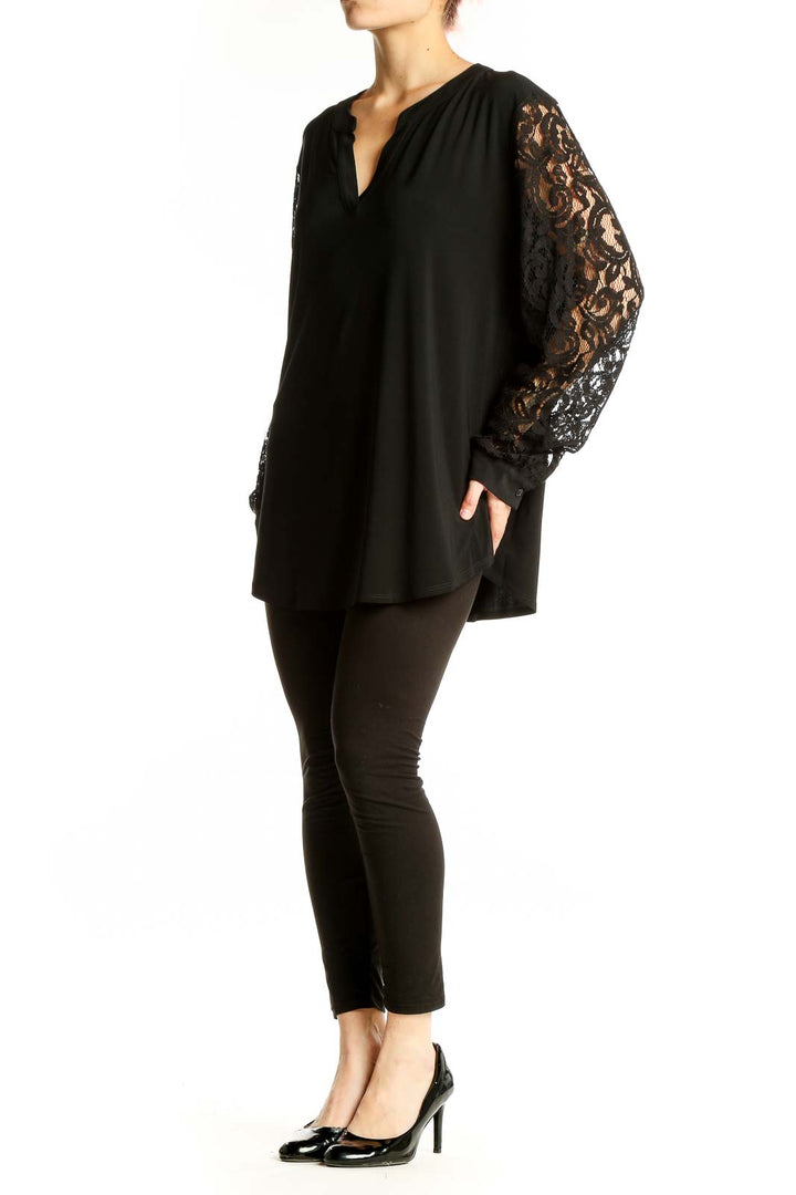 Front view of Kasper black tunic top with lace sleeves and v-neckline