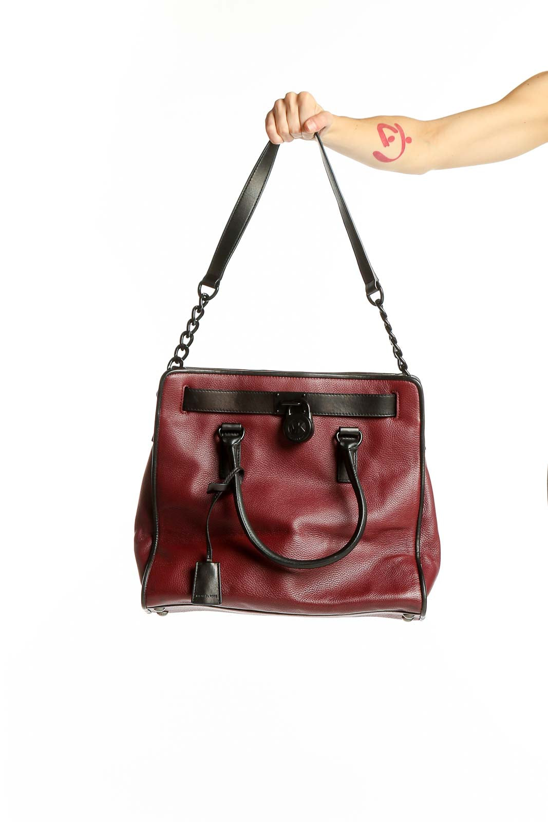 Front view of Michael Kors burgundy leather tote bag with black accents