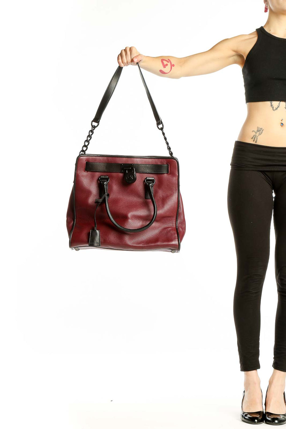 Front view of Michael Kors burgundy leather tote bag with black accents