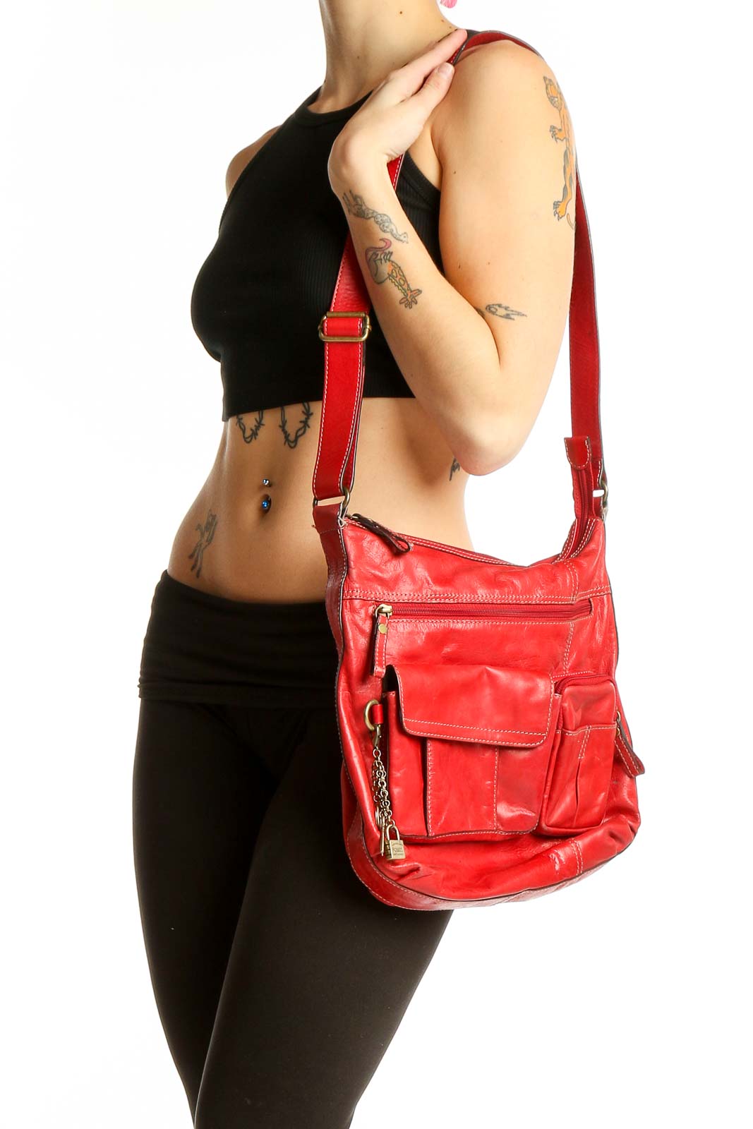Front view of red leather Fossil crossbody bag with multiple pockets