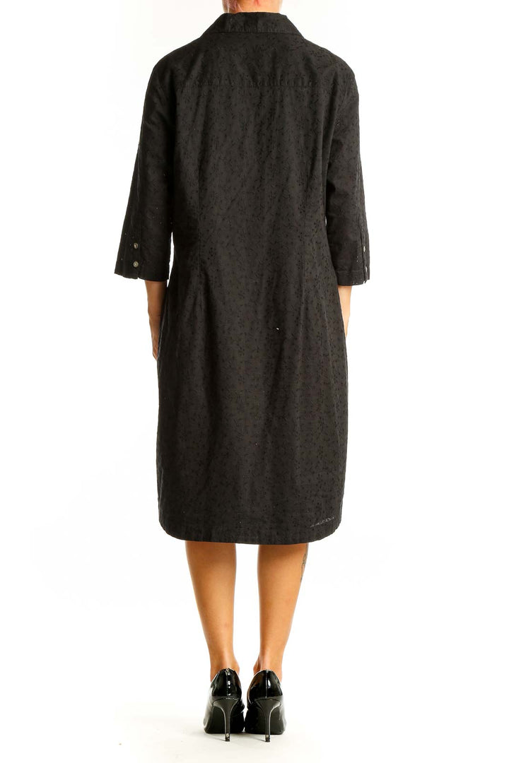 Side view of J.Jill black cotton button-down shirt dress on model