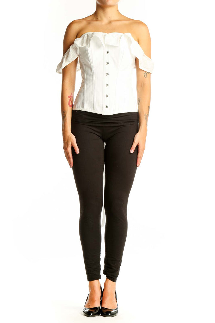 Front view of white off-shoulder corset top with button closure