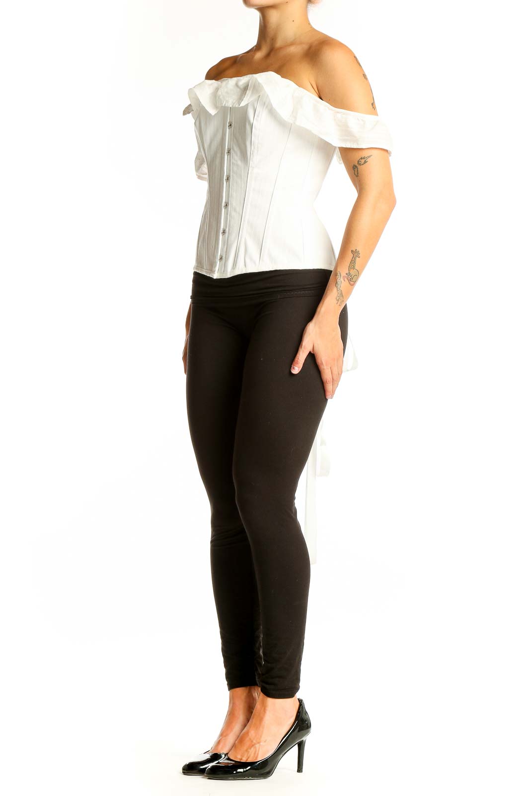 Front view of white off-shoulder corset top with button closure