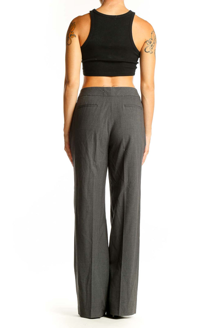 Back view of Calvin Klein gray wide-leg dress pants with black crop top