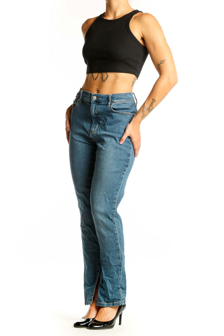 Front view of BDG blue straight leg jeans with split hems