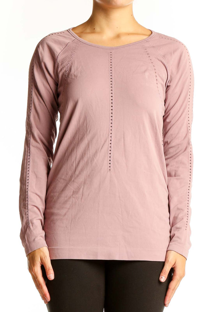 Front view of pink Athleta long sleeve performance top with perforated detailing