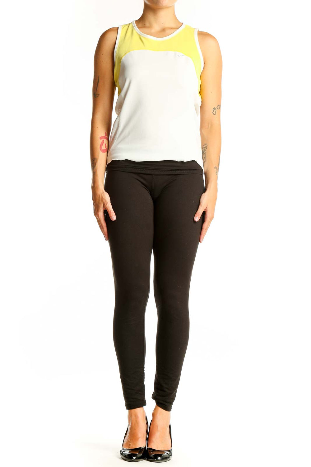 Front view of white Nike athletic tank top with yellow accents
