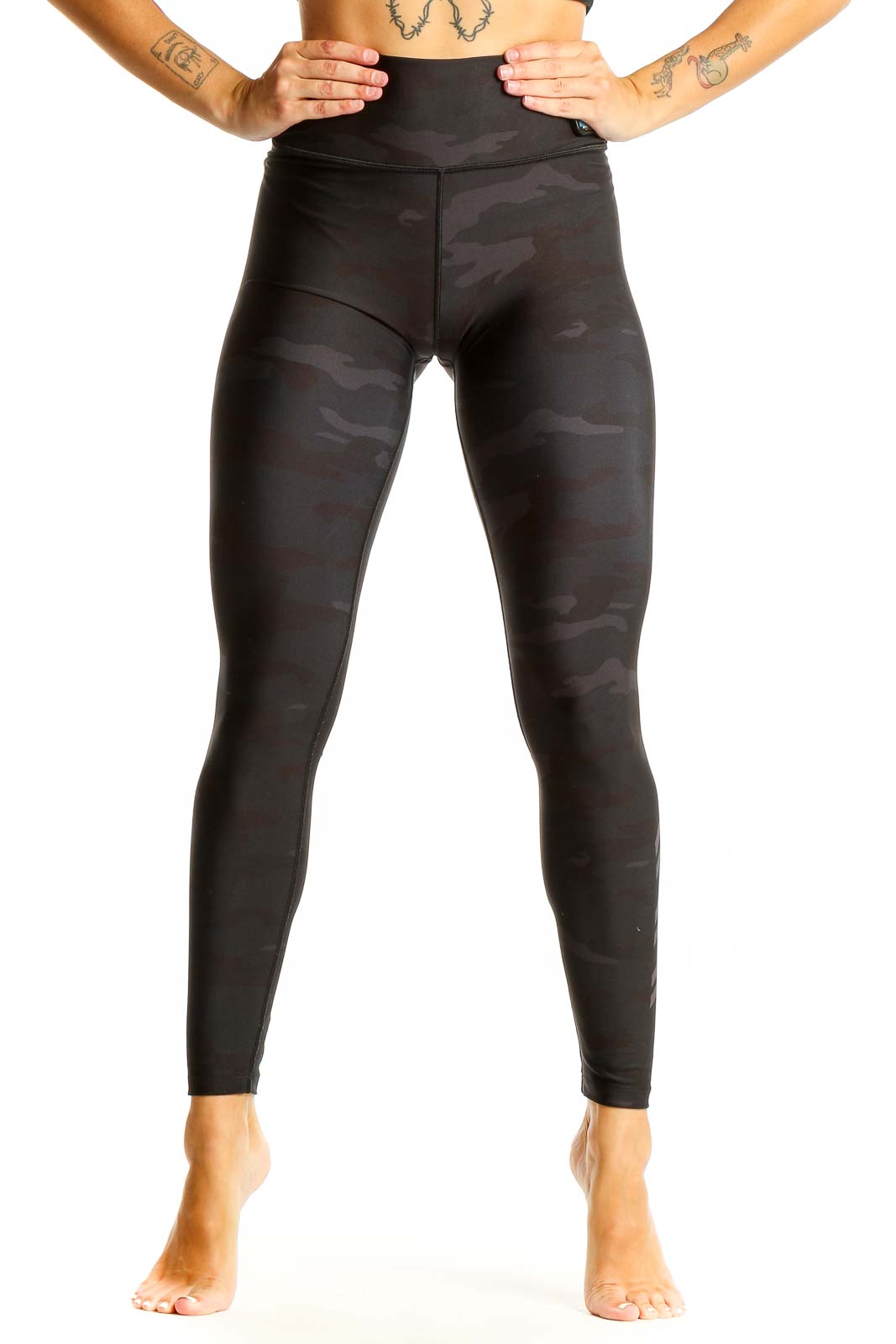 Front view of Barrys black camo high-waisted leggings on model